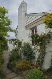 Follow the path through a secret garden to the back of the house.