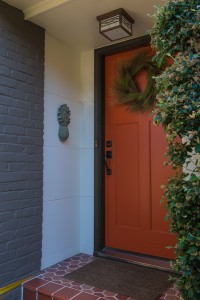 A bold red accents the front door.